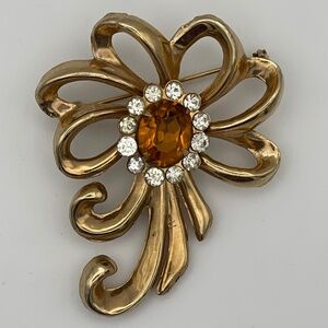 Vintage Brooch Bow Flower Gold Tone Orange Shade Oval Surrounded With Clear Rhin